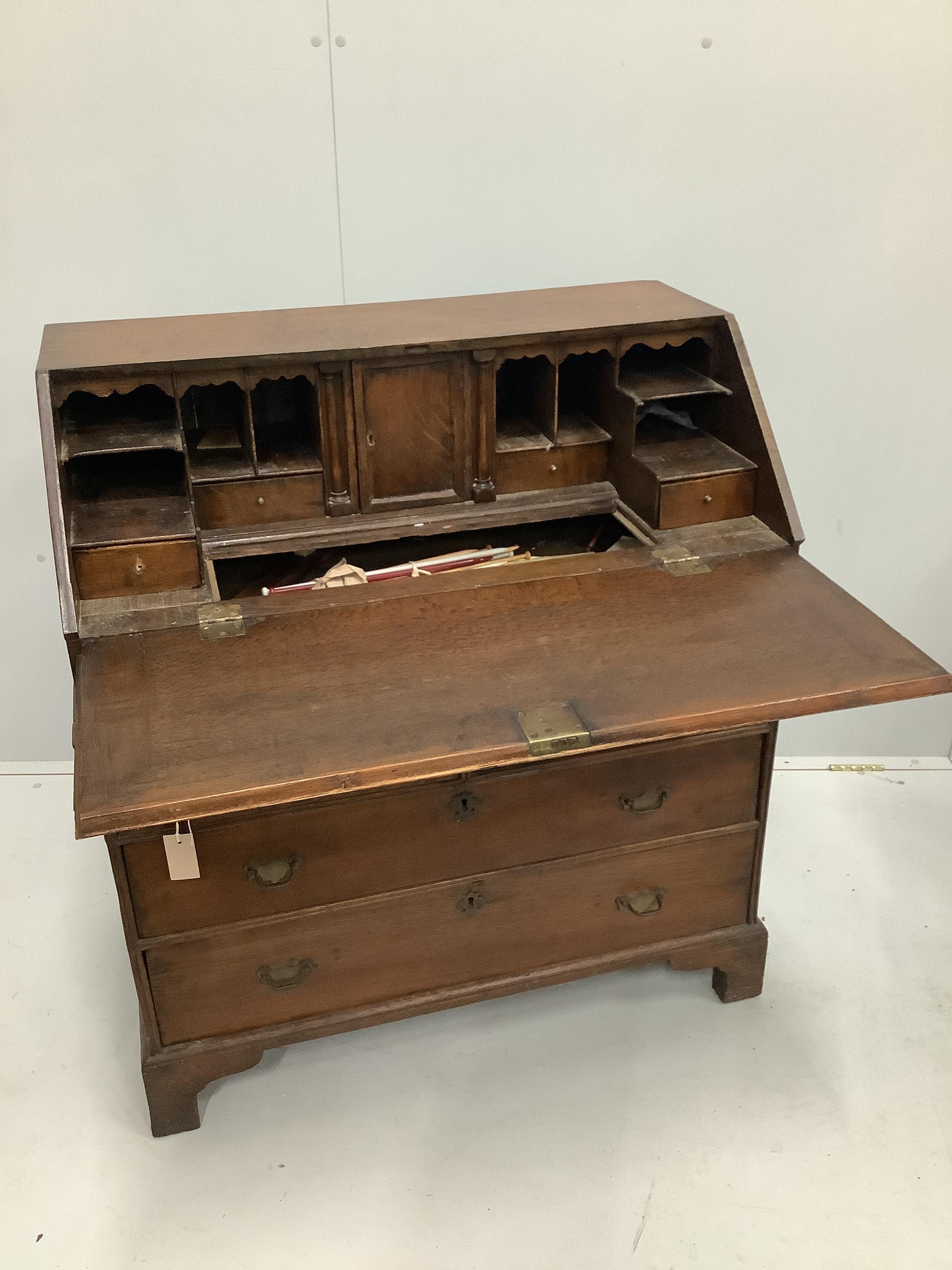 A mid 18th century oak bureau, width 91cm, depth 52cm, height 102cm